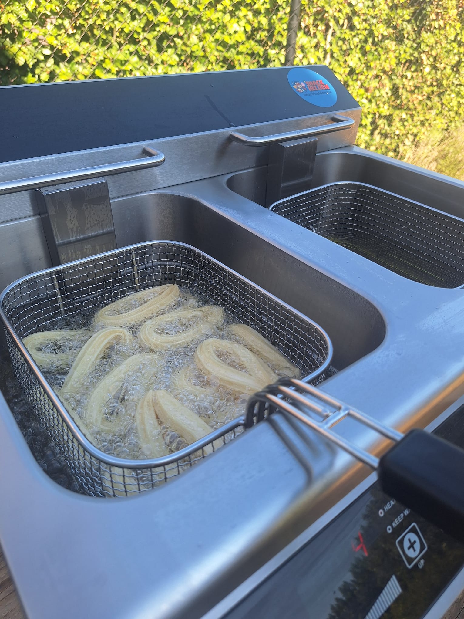 Churros frituren in dubbele roestvrijstalen frituurpan